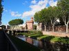 Le Castillet derrière la rivière Basse.